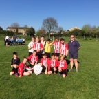 The Year 5/6 Football team with Miss Lizell Spring Term Tournament Final Winners
